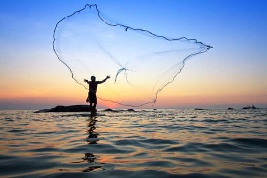 Man throwing a fishing net