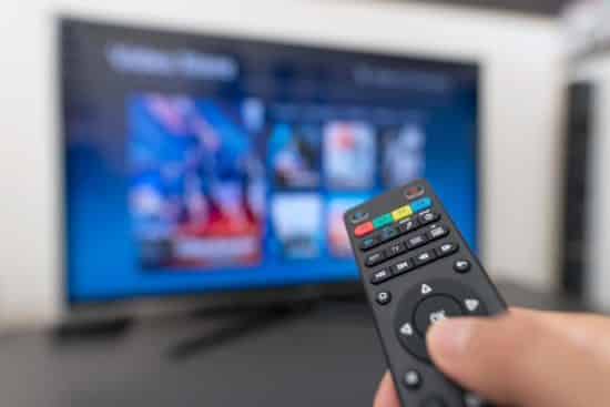 Hand holding remote control