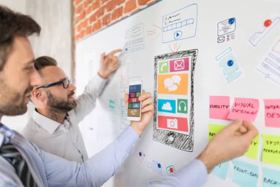 Designers drawing website ux app development