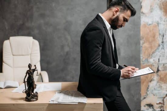 modern architectural law office exterior with woman attorney standing confidently outside